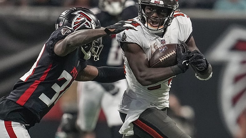 Dec 5, 2021; Atlanta, Georgia, USA; Tampa Bay Buccaneers wide receiver Chris Godwin (14) runs against Atlanta Falcons cornerback Darren Hall (34) during the first half at Mercedes-Benz Stadium. Mandatory Credit: Dale Zanine-USA TODAY Sports