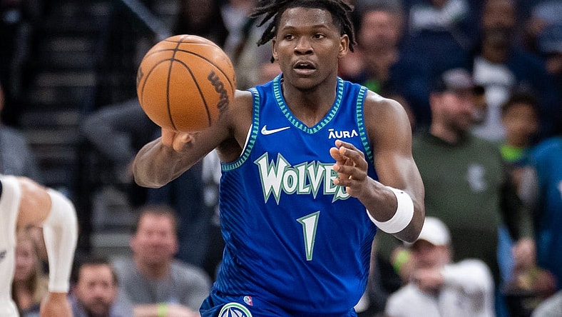 Apr 21, 2022; Minneapolis, Minnesota, USA; Minnesota Timberwolves forward Anthony Edwards (1) passes against the Memphis Grizzlies in the fourth quarter during game one of the three round for the 2022 NBA playoffs at Target Center. Mandatory Credit: Brad Rempel-USA TODAY Sports