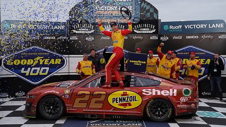May 8, 2022; Darlington, South Carolina, USA; NASCAR Cup Series driver Joey Logano (22) celebrates after winning the Goodyear 400 at Darlington Raceway. Mandatory Credit: Jasen Vinlove-USA TODAY Sports
