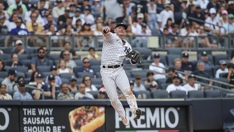 Sep 5, 2022; Bronx, New York, USA;  New York Yankees third baseman Josh Donaldson (28) makes a leaping throw to complete an inning ending double play in the seventh inning against the Minnesota Twins at Yankee Stadium. Mandatory Credit: Wendell Cruz-USA TODAY Sports