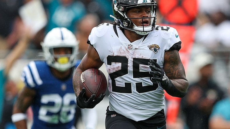 Sep 18, 2022; Jacksonville, Florida, USA; Jacksonville Jaguars running back James Robinson (25) runs for a touchdown against the Indianapolis Colts in the second quarter at TIAA Bank Field. Mandatory Credit: Nathan Ray Seebeck-USA TODAY Sports