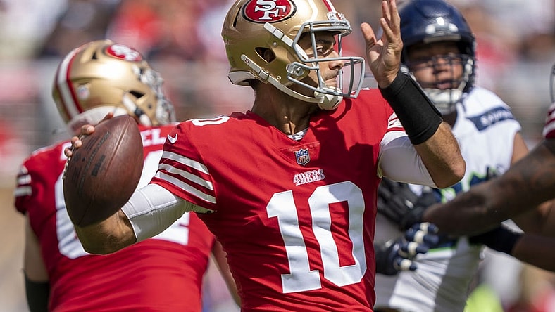 September 18, 2022; Santa Clara, California, USA; San Francisco 49ers quarterback Jimmy Garoppolo (10) passes the football against the Seattle Seahawks during the second quarter at Levi's Stadium. Mandatory Credit: Kyle Terada-USA TODAY Sports