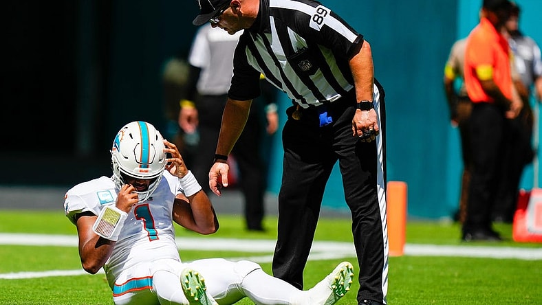 Sep 25, 2022; Miami Gardens, Florida, USA; Miami Dolphins quarterback Tua Tagovailoa (1) lays on the field after apparent injury against the Buffalo Bills during the first quarter at Hard Rock Stadium. Mandatory Credit: Rich Storry-USA TODAY Sports
