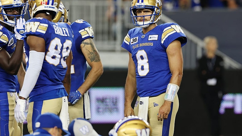 Aug 25, 2022; Winnipeg, Manitoba, CAN; Winnipeg Blue Bombers quarterback Zach Collaros (8) reacts to an injured teammate during the second half against the Calgary Stampeders at IG Field. Winnipeg wins 31-29. Mandatory Credit: Bruce Fedyck-USA TODAY Sports