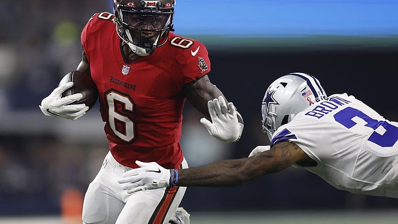 Sep 11, 2022; Arlington, Texas, USA; Tampa Bay Buccaneers wide receiver Julio Jones (6) runs the ball against Dallas Cowboys cornerback Anthony Brown (3) in the second quarter at AT&T Stadium. Mandatory Credit: Tim Heitman-USA TODAY Sports