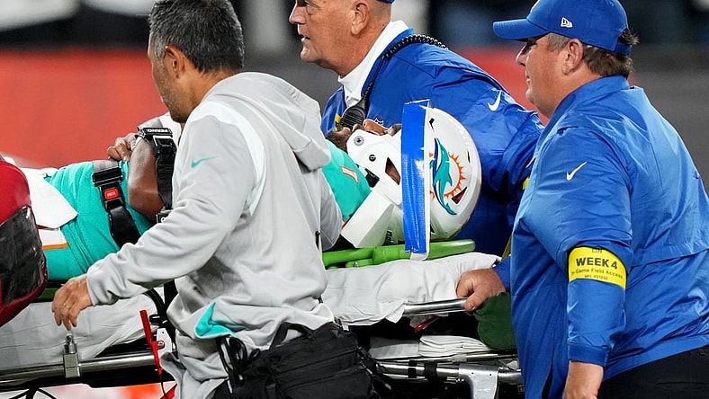 Sep 29, 2022; Cincinnati, Ohio, USA; Miami Dolphins quarterback Tua Tagovailoa (1) is taken off the field after suffering a head injury following a sack by Cincinnati Bengals defensive tackle Josh Tupou (not pictured) in the second quarter at Paycor Stadium in Cincinnati. Mandatory Credit: Kareem Elgazzar-USA TODAY Sports