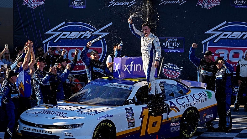 Oct 1, 2022; Talladega, Alabama, USA; NASCAR Xfinity Series driver AJ Allmendinger (16) celebrates winning the Sparks 300 at Talladega Superspeedway. Mandatory Credit: Peter Casey-USA TODAY Sports