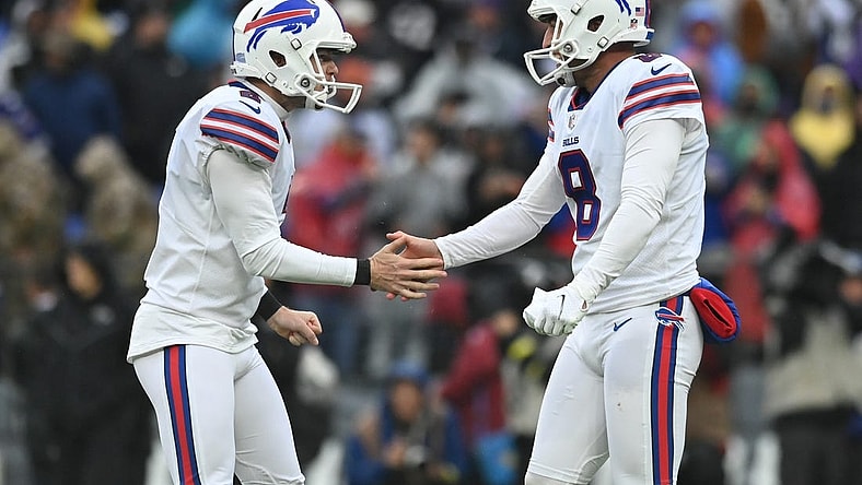 Oct 2, 2022; Baltimore, Maryland, USA;  Buffalo Bills place kicker Tyler Bass (2) celebrates with  punter Sam Martin (8) after kicking the game winning field goal with time expiring against the Baltimore Ravens at M&T Bank Stadium. Mandatory Credit: Tommy Gilligan-USA TODAY Sports