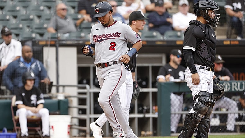 Oct 5, 2022; Chicago, Illinois, USA; Minnesota Twins first baseman Luis Arraez (2) scores against the Chicago White Sox during the second inning at Guaranteed Rate Field. Mandatory Credit: Kamil Krzaczynski-USA TODAY Sports