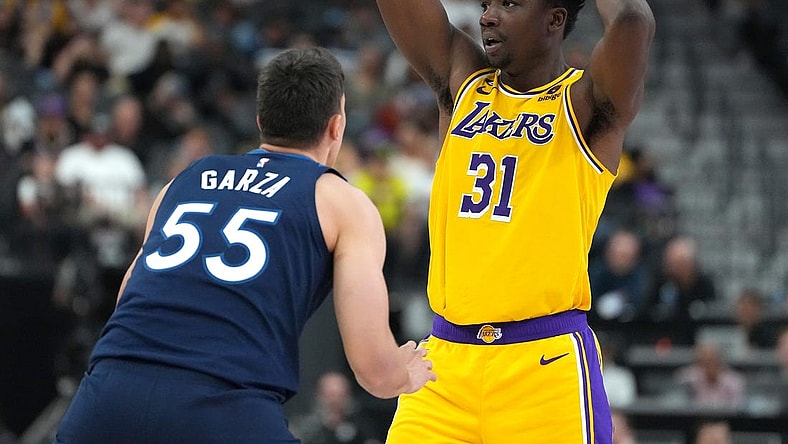 Oct 6, 2022; Las Vegas, Nevada, USA; Los Angeles Lakers center Thomas Bryant (31) looks to pass the ball as Minnesota Timberwolves center Luka Garza (55) defends during a preseason game at T-Mobile Arena. Mandatory Credit: Stephen R. Sylvanie-USA TODAY Sports