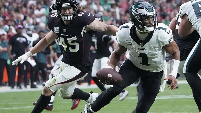 Oct 9, 2022; Glendale, Arizona, U.S.;  Philadelphia Eagles quarterback Jalen Hurts (1) scrambles away from Arizona Cardinals linebacker Dennis Gardeck (45) during the second quarter at State Farm Stadium. Mandatory Credit: Michael Chow-USA TODAY Sports