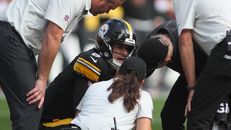 Kenny Pickett (8) of the Pittsburgh Steelers talks to the Steelers medical staff after being sacked during the second half against the Tampa Bay Buccaneers at Acrisure Stadium in Pittsburgh, PA on October 16, 2022.

Pittsburgh Steelers Vs Tampa Bay Buccaneers Week 6