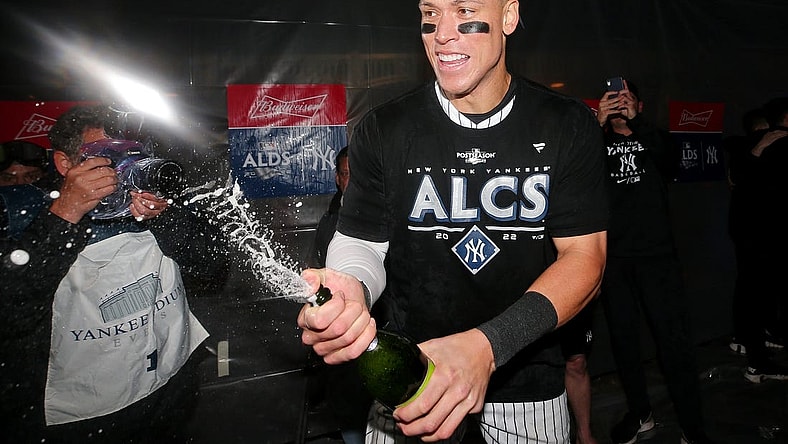 Oct 18, 2022; Bronx, New York, USA; New York Yankees right fielder Aaron Judge (99) celebrates in the clubhouse after their win against the Cleveland Guardians in game five of the ALDS for the 2022 MLB Playoffs at Yankee Stadium. Mandatory Credit: Brad Penner-USA TODAY Sports