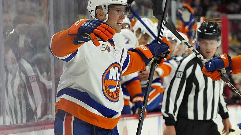 Oct 28, 2022; Raleigh, North Carolina, USA;  New York Islanders right wing Josh Bailey (12) celebrates his goal against the Carolina Hurricanes during the second period at PNC Arena. Mandatory Credit: James Guillory-USA TODAY Sports