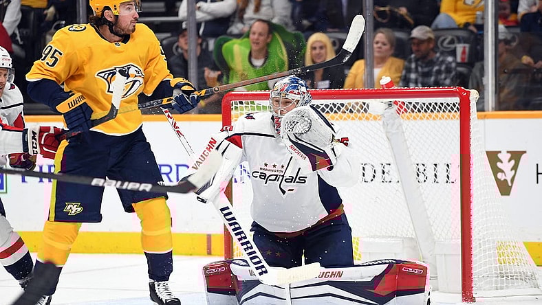 Oct 29, 2022; Nashville, Tennessee, USA; Washington Capitals goaltender Darcy Kuemper (35) watches as a shot is deflected by Nashville Predators center Matt Duchene (95) during the first period at Bridgestone Arena. Mandatory Credit: Christopher Hanewinckel-USA TODAY Sports