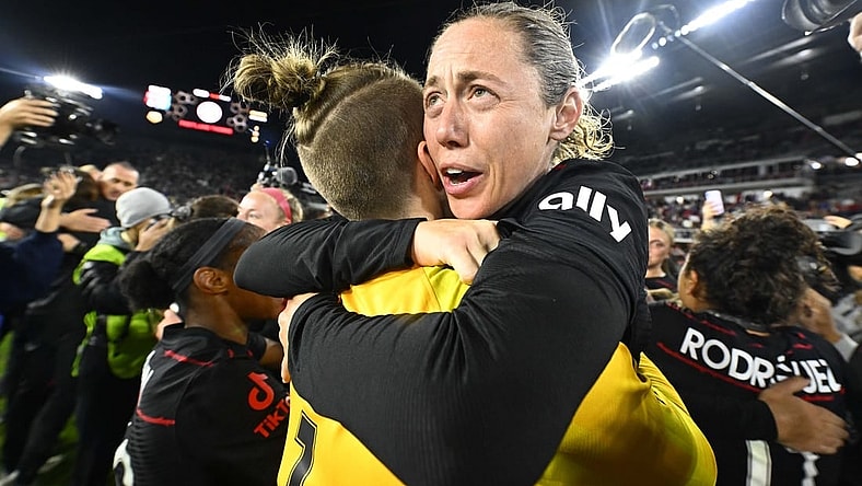 Oct 29, 2022; Washington, D.C., USA; Portland Thorns FC defender Meghan Klingenberg (25) celebrates with Portland Thorns FC goalkeeper Bella Bixby (1) after defeating the Kansas City Current in the NWSL championship game at Audi Field. Mandatory Credit: Brad Mills-USA TODAY Sports