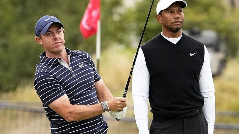Jul 11, 2022; St. Andrews, SCT; Rory McIlroy and Tiger Woods during the R&A Celebration of Champions four-hole challenge at the 150th Open Championship golf tournament at St. Andrews Old Course. Mandatory Credit: Rob Schumacher-USA TODAY Sports