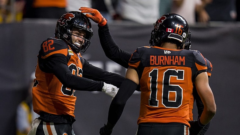 Aug 26, 2022; Vancouver, British Columbia, CAN; BC Lions wide receiver Jacob Scarfone (82) celebrates his touchdown with wide receiver Bryan Burnham (16) in the second half against the Saskatchewan Roughriders at BC Place. Mandatory Credit: Bob Frid-USA TODAY Sports