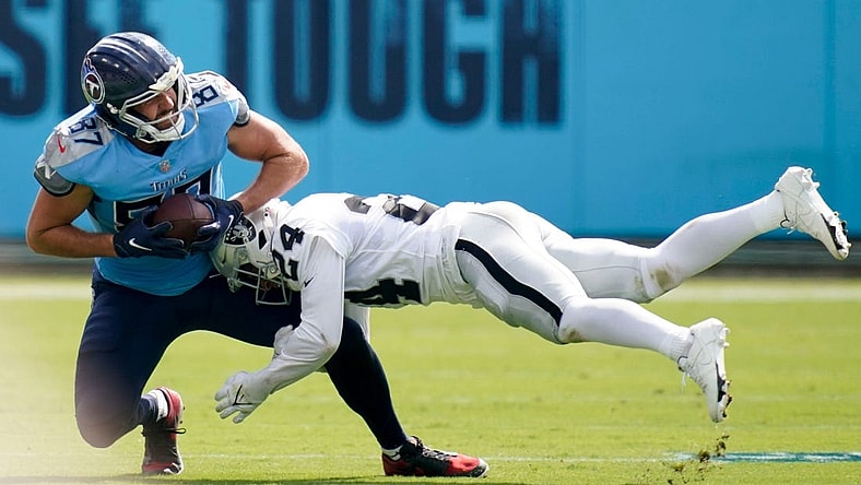 Las Vegas Raiders safety Johnathan Abram (24) tackles Tennessee Titans tight end Geoff Swaim (87) during the second quarter at Nissan Stadium Sunday, Sept. 25, 2022, in Nashville, Tenn.

Nfl Las Vegas Raiders At Tennessee Titans