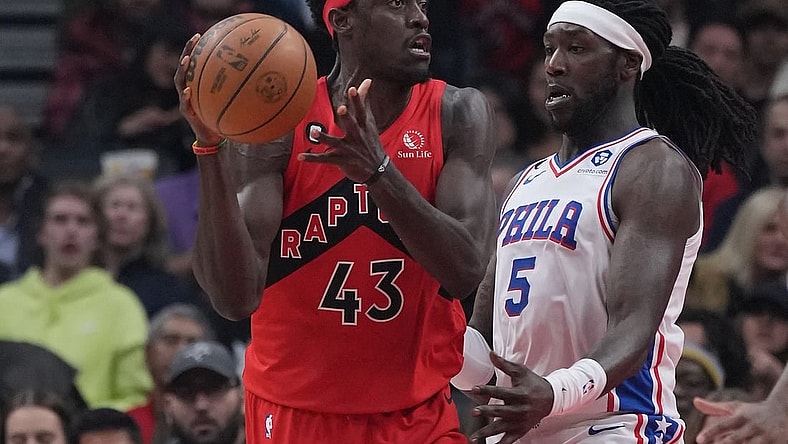 Oct 28, 2022; Toronto, Ontario, CAN; Toronto Raptors forward Pascal Siakam (43) controls the ball as Philadelphia 76ers center Montrezl Harrell (5) tries to defend during the first quarter at Scotiabank Arena. Mandatory Credit: Nick Turchiaro-USA TODAY Sports