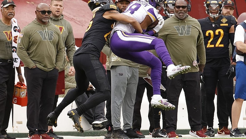 Nov 6, 2022; Landover, Maryland, USA; Minnesota Vikings wide receiver Justin Jefferson (18) catches a pass in front of Washington Commanders cornerback Benjamin St-Juste (25) during the first quarter at FedExField. Mandatory Credit: Geoff Burke-USA TODAY Sports