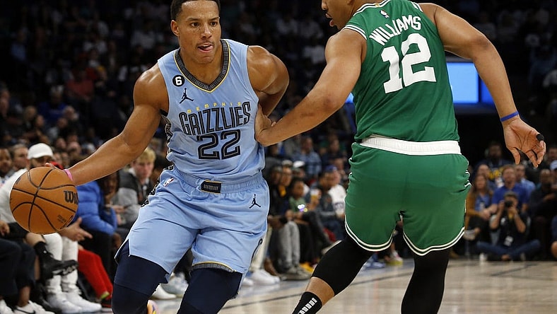 Nov 7, 2022; Memphis, Tennessee, USA; Memphis Grizzlies guard Desmond Bane (22) dribbles around Boston Celtics forward Grant Williams (12) during the first half at FedExForum. Mandatory Credit: Petre Thomas-USA TODAY Sports