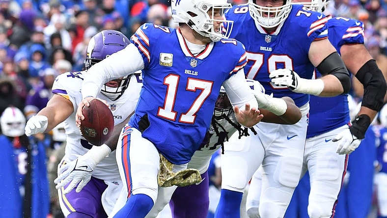 Nov 13, 2022; Orchard Park, New York, USA; Buffalo Bills quarterback Josh Allen (17) runs out of thr pocket against the Minnesota Vikings in the second quarter at Highmark Stadium. Mandatory Credit: Mark Konezny-USA TODAY Sports