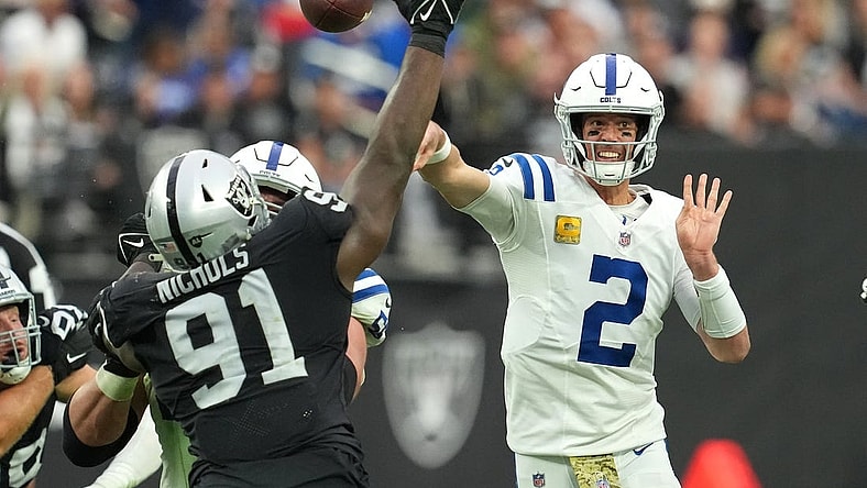 Nov 13, 2022; Paradise, Nevada, USA; Indianapolis Colts quarterback Matt Ryan (2) attempts a pass as Las Vegas Raiders defensive tackle Bilal Nichols (91) looks to deflect the play during the first half at Allegiant Stadium. Mandatory Credit: Stephen R. Sylvanie-USA TODAY Sports