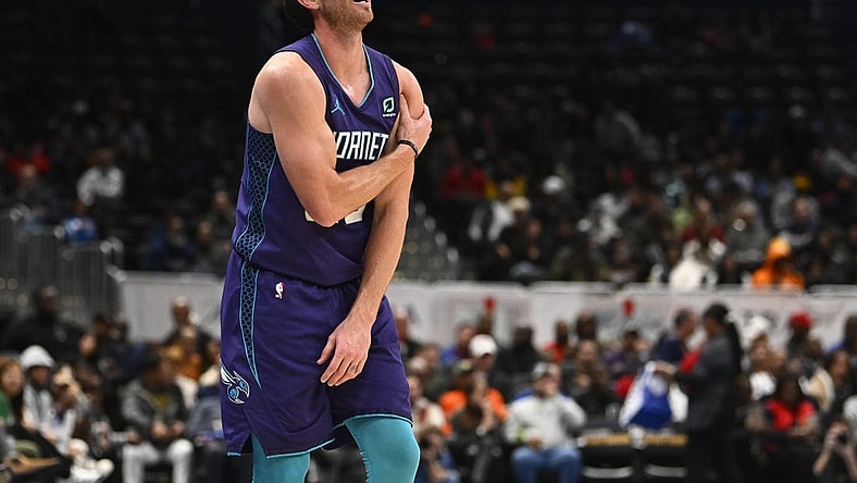 Nov 20, 2022; Washington, District of Columbia, USA; Charlotte Hornets forward Gordon Hayward (20) grabs his shoulder against the Washington Wizards during the second half at Capital One Arena. Mandatory Credit: Brad Mills-USA TODAY Sports