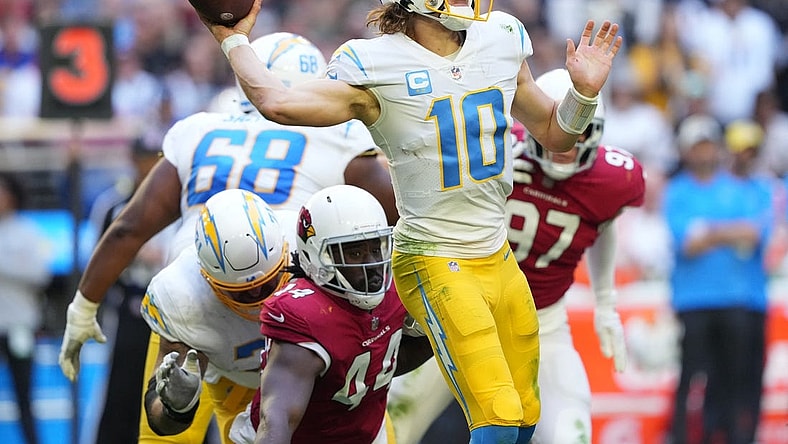Nov 27, 2022; Glendale, AZ, USA; Los Angeles Chargers quarterback Justin Herbert (10) throws a pass against the Arizona Cardinals in the second half at State Farm Stadium. Mandatory Credit: Joe Camporeale-USA TODAY Sports