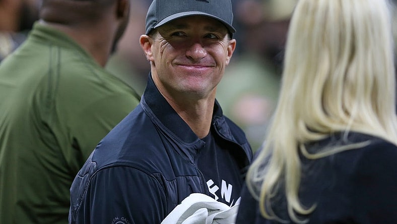 Nov 20, 2022; New Orleans, Louisiana, USA; Former New Orleans Saints quarterback Drew Brees on the sidelines in the first quarter of the game between the New Orleans Saints and the Los Angeles Rams at the Caesars Superdome. Mandatory Credit: Chuck Cook-USA TODAY Sports