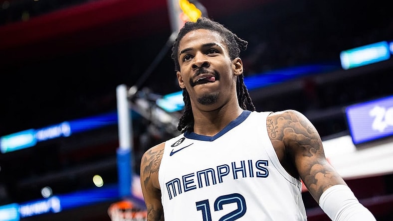 Dec 4, 2022; Detroit, Michigan, USA; Memphis Grizzlies guard Ja Morant (12) looks at the crowd after making a basket in the second half against the Detroit Pistons at Little Caesars Arena. Mandatory Credit: Allison Farrand-USA TODAY Sports