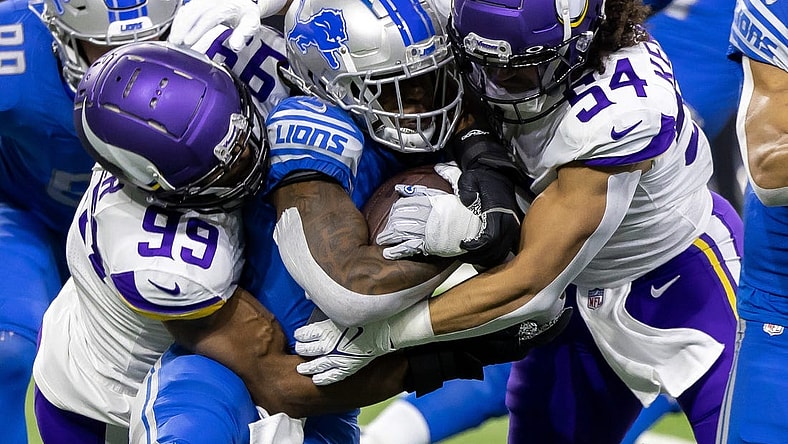 Dec 11, 2022; Detroit, Michigan, USA; Detroit Lions running back Jamaal Williams (30) is tackled by Minnesota Vikings linebacker Danielle Hunter (99) and linebacker Eric Kendricks (54) during the first quarter at Ford Field. Mandatory Credit: David Reginek-USA TODAY Sports