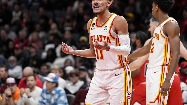Dec 11, 2022; Atlanta, Georgia, USA; Atlanta Hawks guard Trae Young (11) reacts after being called for a foul against the Chicago Bulls during the second half at State Farm Arena. Mandatory Credit: Dale Zanine-USA TODAY Sports