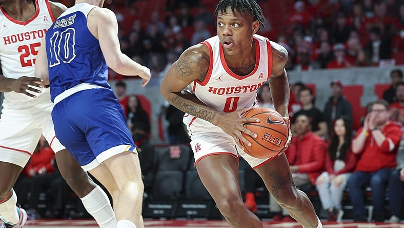 Dec 21, 2022; Houston, Texas, USA; Houston Cougars guard Marcus Sasser (0) grabs a rebound during the first half against the McNeese State Cowboys at Fertitta Center. Mandatory Credit: Troy Taormina-USA TODAY Sports