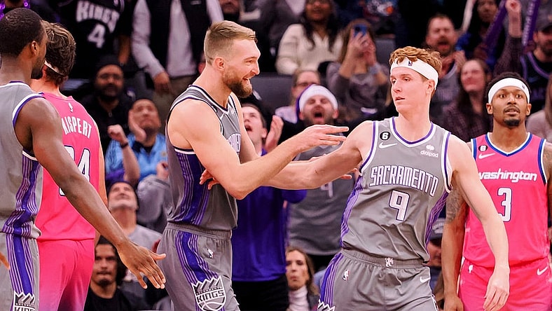 Dec 23, 2022; Sacramento, California, USA; Sacramento Kings power forward Domantas Sabonis (10) celebrates with shooting guard Kevin Huerter (9) after a play against the Washington Wizards during the fourth quarter at Golden 1 Center. Mandatory Credit: Kelley L Cox-USA TODAY Sports