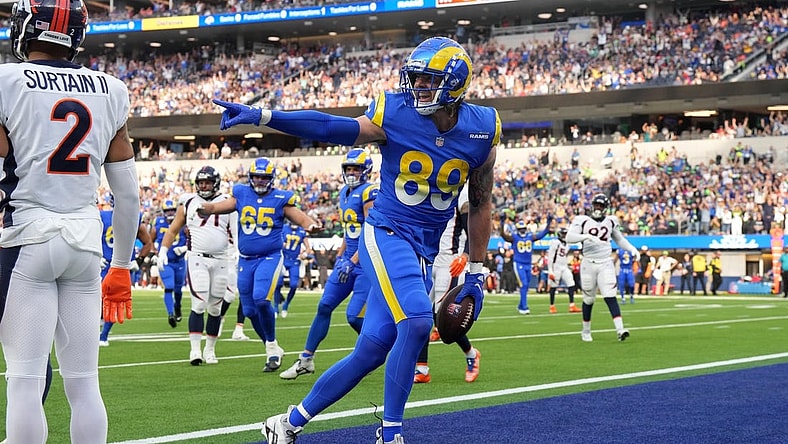 Dec 25, 2022; Inglewood, California, USA; Los Angeles Rams tight end Tyler Higbee (89) celebrates after scoring on a 9-yard touchdown pass against Denver Broncos cornerback Pat Surtain II (2) in the first half at SoFi Stadium. Mandatory Credit: Kirby Lee-USA TODAY Sports