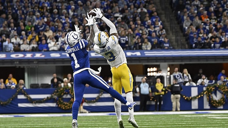 Dec 26, 2022; Indianapolis, Indiana, USA;  Los Angeles Chargers safety Derwin James Jr. (3) intercepts a pass meant for Indianapolis Colts wide receiver Parris Campbell (1) during the first quarter at Lucas Oil Stadium. Mandatory Credit: Marc Lebryk-USA TODAY Sports