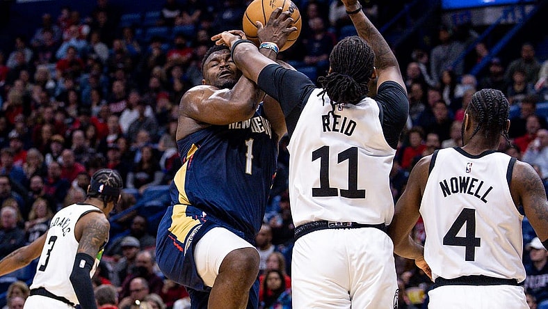 Dec 28, 2022; New Orleans, Louisiana, USA; Minnesota Timberwolves center Naz Reid (11) fouls New Orleans Pelicans forward Zion Williamson (1) as he goes to the basket during the first half at Smoothie King Center. Mandatory Credit: Stephen Lew-USA TODAY Sports