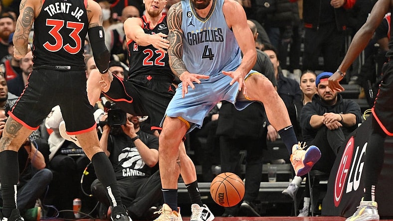 Dec 29, 2022; Toronto, Ontario, CAN;  Memphis Grizzlies center Steven Adams (4) grabs a rebound in front of Toronto Raptors guard Malachi Flynn (22) in the first half at Scotiabank Arena. Mandatory Credit: Dan Hamilton-USA TODAY Sports