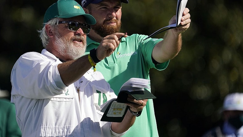Nov 12, 2020; Augusta, Georgia, USA; Shane Lowry looks down the tenth fairway with his caddie Brian Martin during the first round of The Masters golf tournament at Augusta National GC. Mandatory Credit: Rob Schumacher-USA TODAY Sports