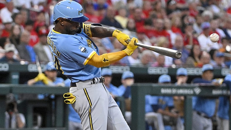 Sep 13, 2022; St. Louis, Missouri, USA;  Milwaukee Brewers designated hitter Andrew McCutchen (24) hits a one run double against the St. Louis Cardinals during the first inning at Busch Stadium. Mandatory Credit: Jeff Curry-USA TODAY Sports