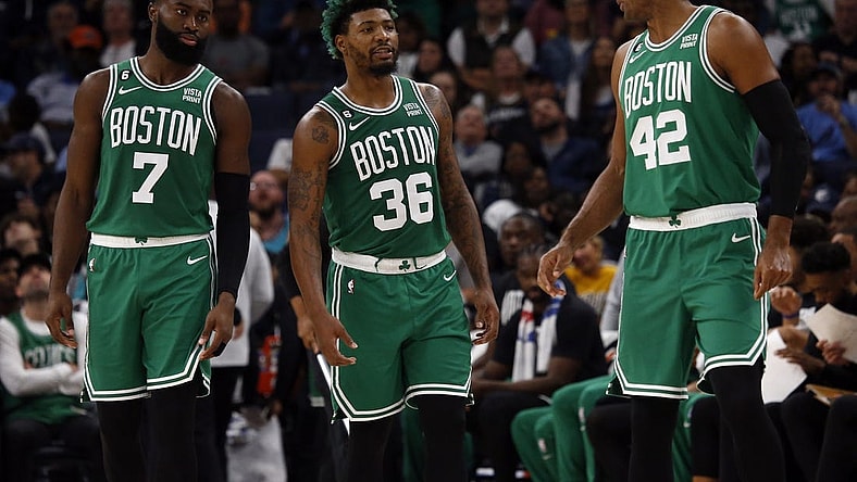 Nov 7, 2022; Memphis, Tennessee, USA; Boston Celtics guard Jaylen Brown (7) guard Marcus Smart (36) and  center Al Horford (42) talk during a timeout during the first half against the Memphis Grizzlies at FedExForum. Mandatory Credit: Petre Thomas-USA TODAY Sports