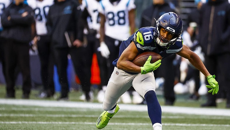 Dec 11, 2022; Seattle, Washington, USA; Seattle Seahawks wide receiver Tyler Lockett (16) runs for yards after the catch against the Carolina Panthers during the second quarter at Lumen Field. Mandatory Credit: Joe Nicholson-USA TODAY Sports
