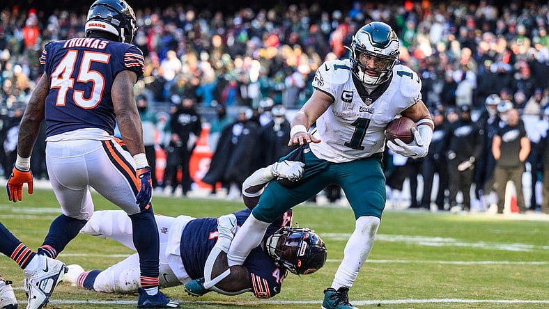 Dec 18, 2022; Chicago, Illinois, USA; Philadelphia Eagles quarterback Jalen Hurts (1) rushes for a two point conversion in the fourth quarter against the Chicago Bears at Soldier Field. Mandatory Credit: Daniel Bartel-USA TODAY Sports
