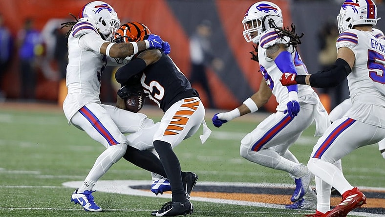 Jan 2, 2023; Cincinnati, Ohio, USA; Buffalo Bills safety Damar Hamlin (3) makes the tackle on Cincinnati Bengals wide receiver Tee Higgins (85) during the first quarterat Paycor Stadium. The play led to Hamlin collapsing on the field, and being taken to the hospital in critical condition. Mandatory Credit: Joseph Maiorana-USA TODAY Sports