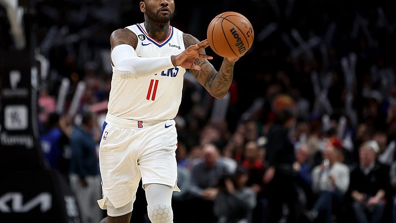 Jan 8, 2023; Los Angeles, California, USA;  Los Angeles Clippers guard John Wall (11) passes the ball during the fourth quarter against the Atlanta Hawks at Crypto.com Arena. Mandatory Credit: Kiyoshi Mio-USA TODAY Sports