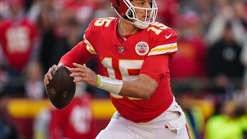 Jan 1, 2023; Kansas City, Missouri, USA; Kansas City Chiefs quarterback Patrick Mahomes (15) throws a pass during the second half against the Denver Broncos at GEHA Field at Arrowhead Stadium. Mandatory Credit: Jay Biggerstaff-USA TODAY Sports