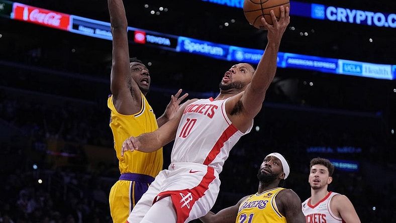 Jan 16, 2023; Los Angeles, California, USA; Houston Rockets guard Eric Gordon (10) shoots the ball against Los Angeles Lakers center Thomas Bryant (31) in the first half at Crypto.com Arena. Mandatory Credit: Kirby Lee-USA TODAY Sports