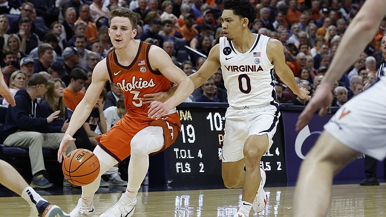 Jan 18, 2023; Charlottesville, Virginia, USA; Virginia Tech Hokies guard Sean Pedulla (3) drives to the basket as Virginia Cavaliers guard Kihei Clark (0) defends in the first half at John Paul Jones Arena. Mandatory Credit: Geoff Burke-USA TODAY Sports